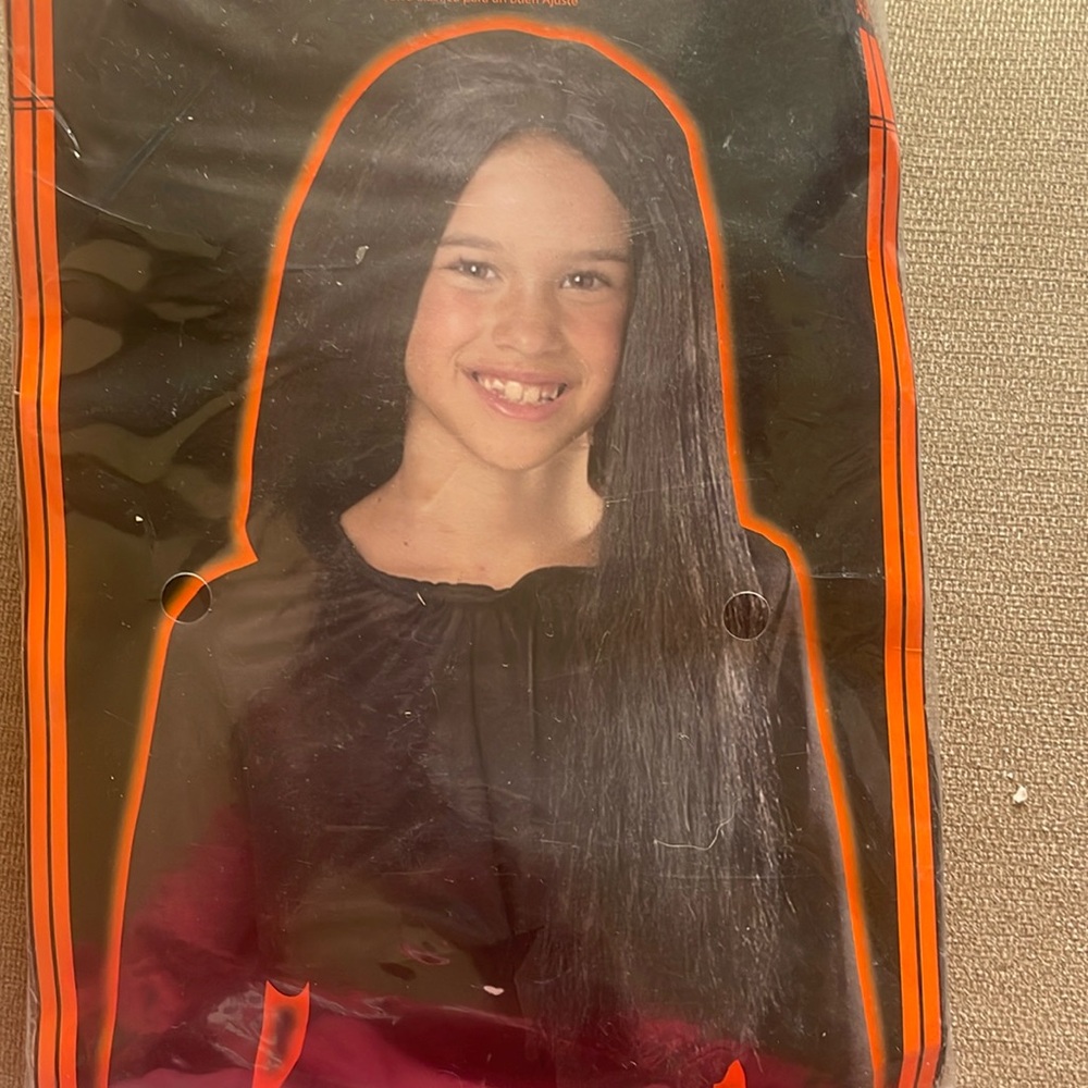 Child’s wig in black never worn brand new